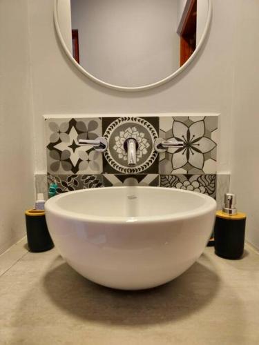 a bathroom with a white sink and a mirror at Complejo de Cabañas Eco-sustentables - La escondida - in San Salvador de Jujuy