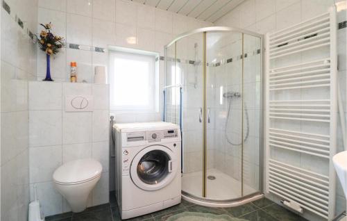 a bathroom with a washing machine and a shower at Awesome Home In Oberhaag With 1 Bedrooms in Oberhaag
