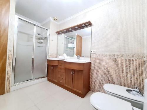 a bathroom with a shower and a sink and a toilet at 1HAB en Castillo Santa Clara in Torremolinos