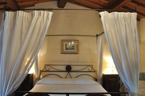 Ένα ή περισσότερα κρεβάτια σε δωμάτιο στο La Fattoressa