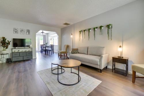 a living room with a couch and a table at Centrally Located Reno Retreat with Patio and Yard in Reno