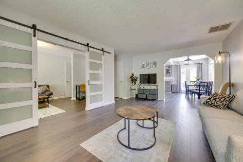 a living room with a couch and a table at Centrally Located Reno Retreat with Patio and Yard in Reno