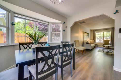 a dining room and living room with a table and chairs at Centrally Located Reno Retreat with Patio and Yard in Reno