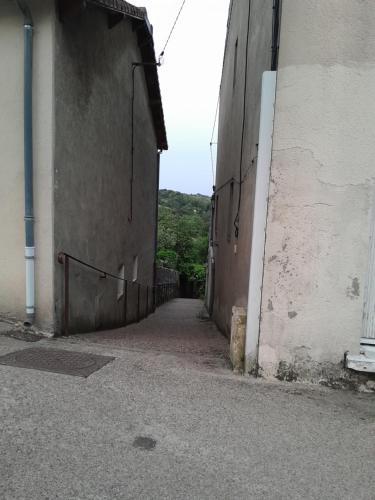 an alleyway between two buildings in a building at Studio 17 min puy du fou in Pouzauges