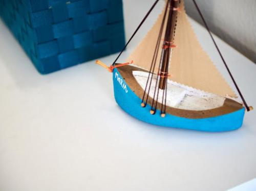 a model of a wooden boat on a table at Guesthouse Ana Trogir Old Town in Trogir