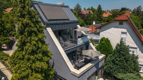 an aerial view of a house with trees at Bazalt Apartman in Badacsonytomaj
