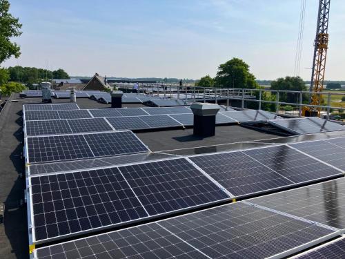 a group of solar panels on top of a roof at Stayokay Hostel Noordwijk in Noordwijk