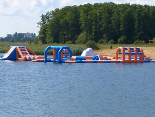 a group of inflatable play structures in the water at Krok od Biebrzy in Dolistowo Stare