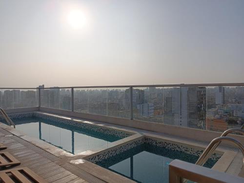a swimming pool on the roof of a building at lovely apartament with hydromassage in Lima
