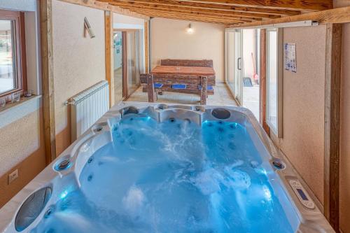a large blue tub in a room with a table at Villa Simac With Pool and Whirlpool - Happy Rentals in Pazin