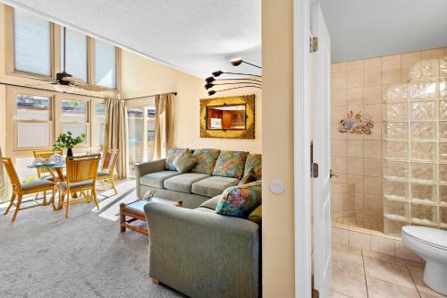 a living room with a couch and a table at Kihei Sands B2 in Kihei