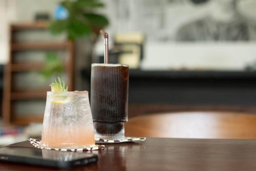 a drink sitting on top of a table at S 2 Modern Boutique Hotel in Vientiane