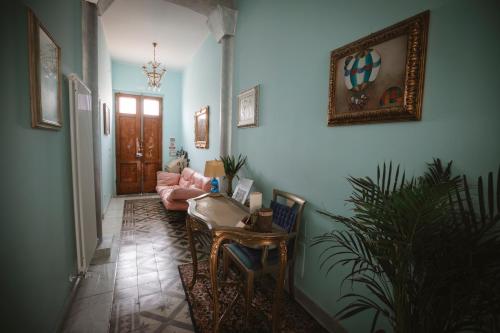 a living room with a couch and a table at Villa Valentina Versilia in Viareggio