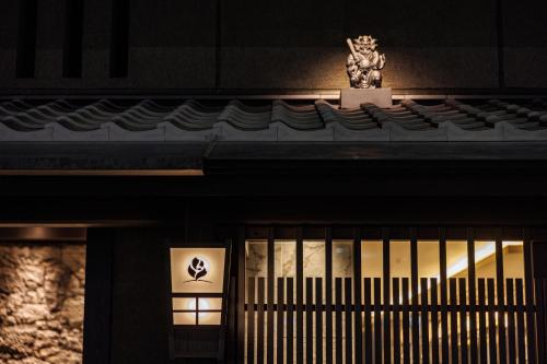 a statue sitting on the top of a building at THE BLOSSOM KYOTO in Kyoto