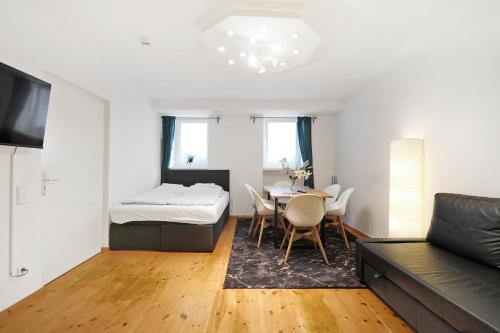 a living room with a bed and a table at Central Apartment near Potsdamer Platz in Berlin