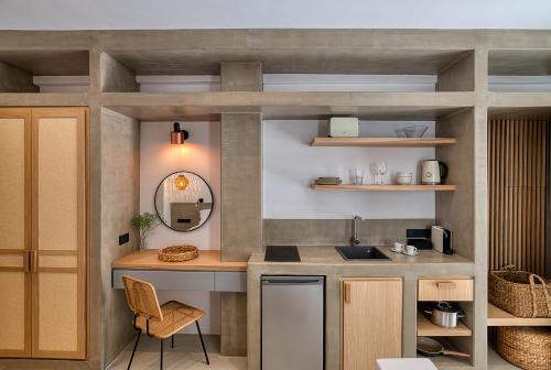 a kitchen with a sink and a counter top at Clementina Paros in Naousa