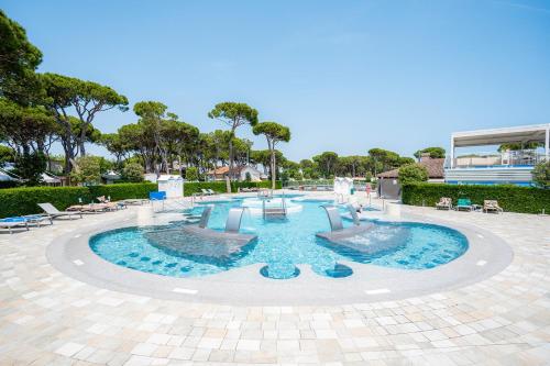 a large pool with blue water in the middle at Glamping Cavallino in Cavallino-Treporti