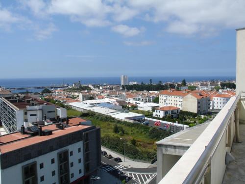a view of a city from the balcony of a building at VIP Executive Azores Hotel in Ponta Delgada