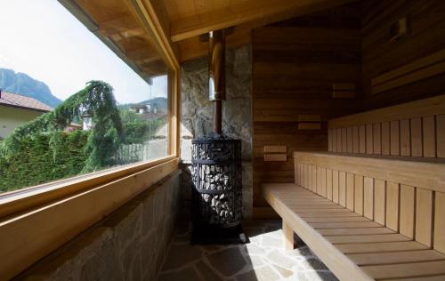 a room with benches and a window with a view at Hotel Belfiore in Monclassico