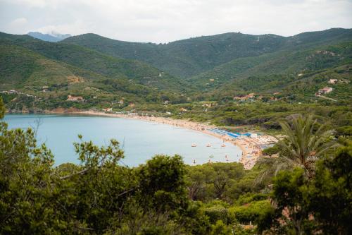 a view of a beach with people in the water at Glamping at Elba in Lacona
