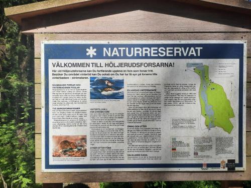 a sign for a national park with a map at Hemtrevlig villa i Billingsfors in Billingsfors