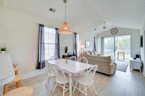 a living room with a table and chairs and a couch at 4 Mi to Broadway at the Beach Golf Resort Getaway in Myrtle Beach