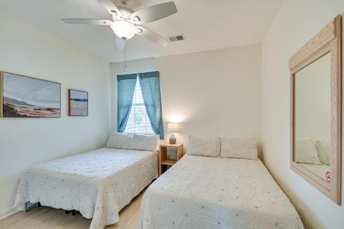 a bedroom with two beds and a ceiling fan at 4 Mi to Broadway at the Beach Golf Resort Getaway in Myrtle Beach