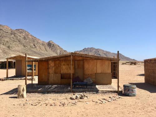 a small building in the middle of the desert at Peace land camp in Nuweiba