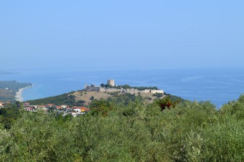 a castle on top of a hill with the ocean at View of the Castle and the Sea 1 in Platamonas