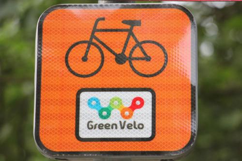 an orange sign with a bike on it at FoRest Inn in Trzepieciny