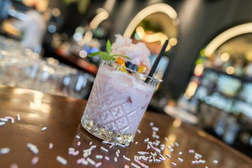 a drink sitting on top of a table at Lifesteil Aparthotel in Umhausen