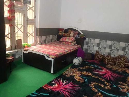 a bedroom with a bed in a room with a rug at POP Ain Ul Noor Homestay in Thanna Mandi