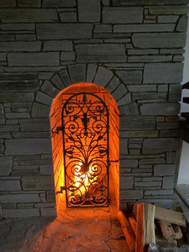a brick oven with an orange light in it at Ferienhaus Lemsitz 34 in Lemsitz