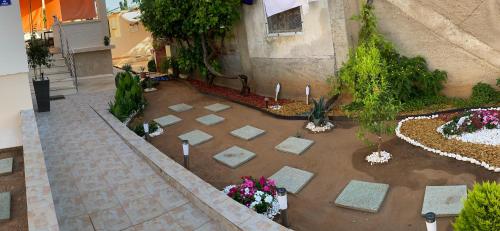 an aerial view of a garden with flowers in a courtyard at LuMar Holidays and Apartments in Preko