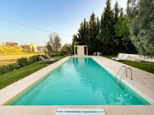 a swimming pool in the backyard of a house at La Casa del Poeta Enna - Pergusa in Enna