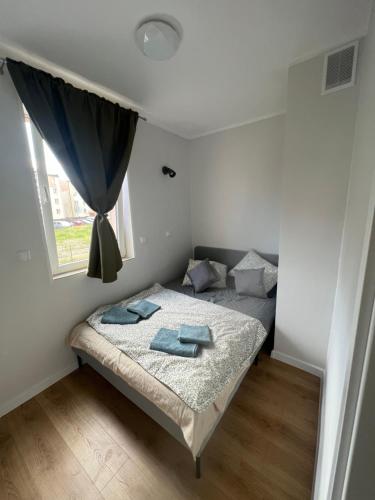 Postel nebo postele na pokoji v ubytování Apartament Hel 35 m2