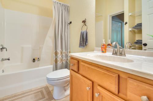 a bathroom with a sink and a toilet and a tub at Blue Ridge Mountain Home with Sunroom Pets Welcome in Fairview