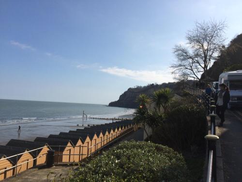 a view of a beach with a fence and the ocean at Marlborough Hotel in Shanklin