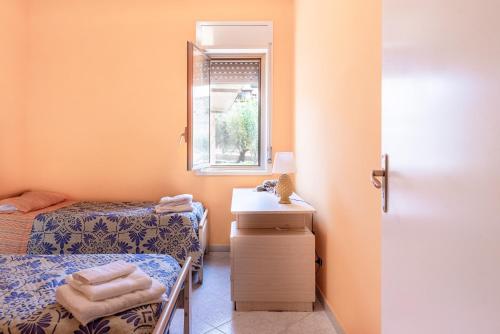 Ένα ή περισσότερα κρεβάτια σε δωμάτιο στο Villa Tre 's'