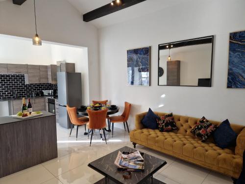 a living room with a couch and a table at 7 Holly Barn in Preston