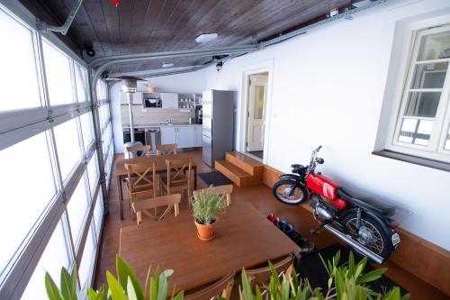 a room with a table and a motorcycle on it at COUNTRY HOUSE Tisá in Tisá
