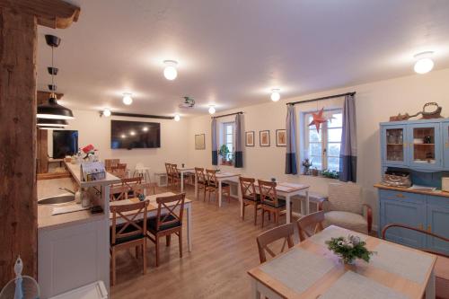 a kitchen and dining room with tables and chairs at COUNTRY HOUSE Tisá in Tisá