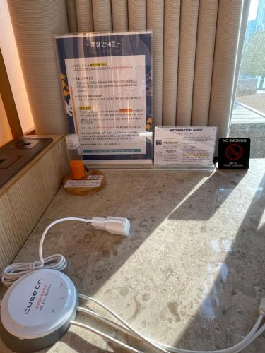 a wii controller sitting on top of a kitchen counter at Gwanganli The Club Hotel in Busan