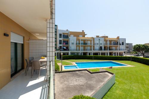 a view from the balcony of a house with a swimming pool at Apartamento Bela Vista - Minho's Guest in Esposende