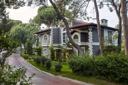 a house on the side of a road at Maxx Royal Belek Golf Resort in Belek