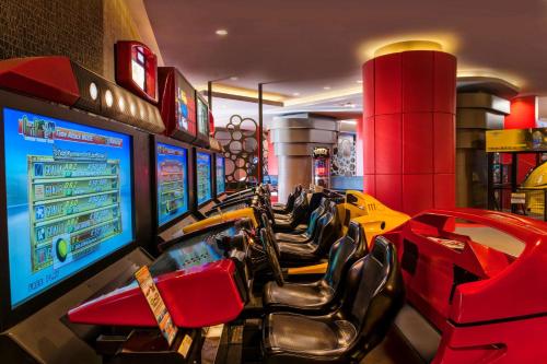 a video game room with a bunch of arcade machines at Maxx Royal Belek Golf Resort in Belek