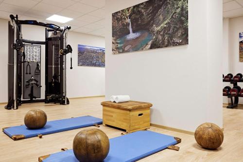 a room with yoga mats and a gym at Parkhotel Oberstaufen in Oberstaufen