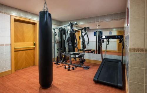a gym with a punching bag in a room at Lindner Hotel Prague Castle, part of JdV by Hyatt in Prague