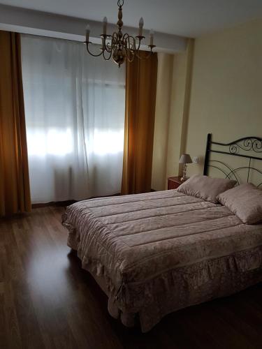 Ένα ή περισσότερα κρεβάτια σε δωμάτιο στο Casa Camiño dos Faros