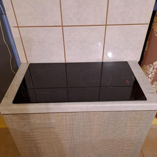a bath tub with a black inside of it at Zenia Home 1 Στην καρδιά της Πάτρας in Patra